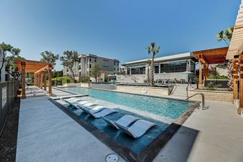 Resort-style infinity edge pool with lounging edge